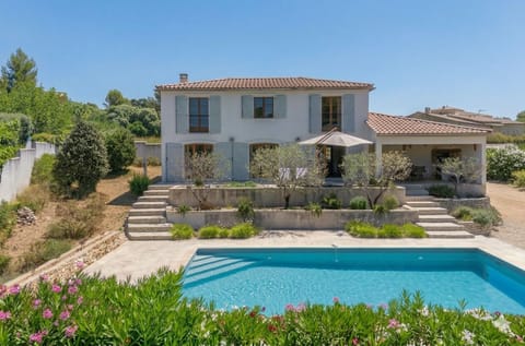 Exterior showing the garden with swimming pool and covered terrace