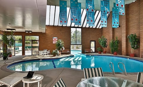 Float, play, and recharge in a bright indoor pool oasis.