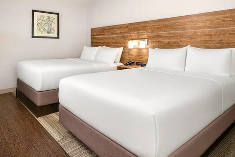 Unwind in crisp, cloud-soft beds after a full day out.