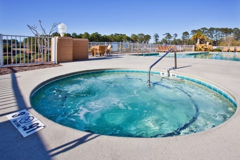 Unwind in bubbling hot tub after a day of exploring