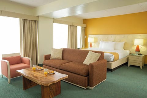 Stretch out on the roomy sofa with snacks and morning light.
