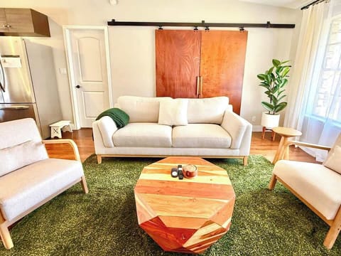Our living room is equipped with a 65” Smart TV with streaming apps for your entertainment. We also have an overhead fan, books, and games.