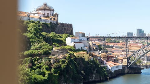 Wake up to Porto at its most iconic, with the green slopes of Serra do Pilar, the Douro River and Dom Luís I Bridge stretching across the skyline.
#PortoView #DouroRiver #DomLuisIBridge #VisitPorto