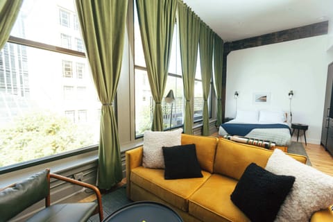 Welcome to your sun-drenched downtown retreat — tall ceilings, huge windows, and thoughtful design throughout.