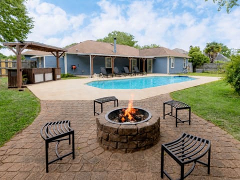 Outdoor space featuring all you want for entertainment  - in ground pool, fire pit, & grill 