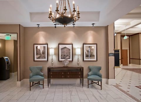 Inviting lobby adorned with vintage art and soft lighting.