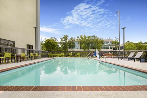 Start your day with sunshine, lounge chairs, and calm water.