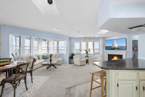 Bright, open-concept living with coastal charm, cozy fireplace, and relaxing lake-inspired vibes.