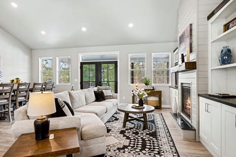 The living area offers comfortable seating, a cozy fireplace, and a TV, creating the perfect spot to relax and unwind.