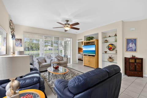 Spacious living room with comfortable seating and entertainment center.