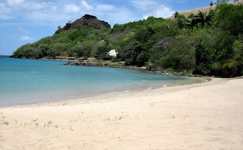 Stroll to soft sands and calm turquoise water nearby.