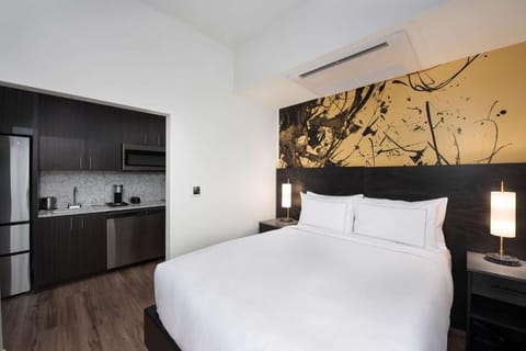Settle into a stylish studio with bed-to-kitchen convenience.