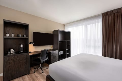Unwind and stay productive with desk, TV, and daylight.