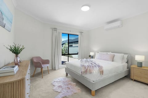Light-filled retreat with cozy bedding and calming décor for ultimate relaxation