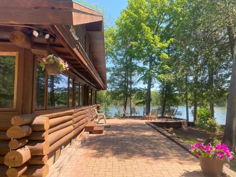 A breathtaking view of Briar Lake Lodge, showcasing the gorgeous scenery and highlighting the beauty of this log cabin.