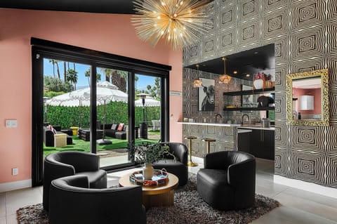 Conversation area & swanky bar w/ outdoor access through collapsable glass door