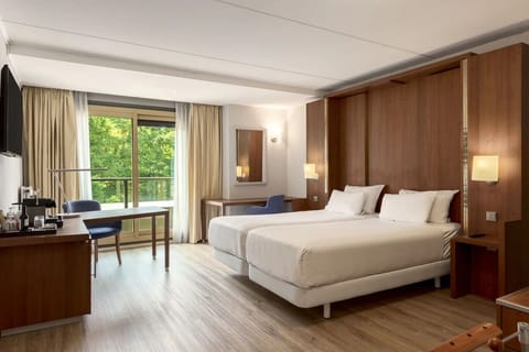 Wake up to soft daylight and serene views from bed.