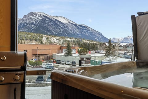 Relaxing spa with views of surrounding peaks.
