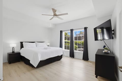Private king suite featuring a comfortable bed, smart TV, and a peaceful retreat after long park days