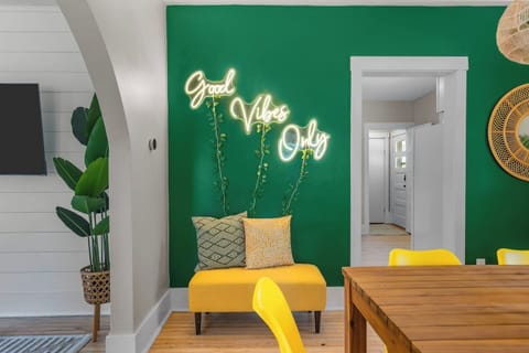 The neon sign says it all—eat, laugh, and leave the negativity at the door.