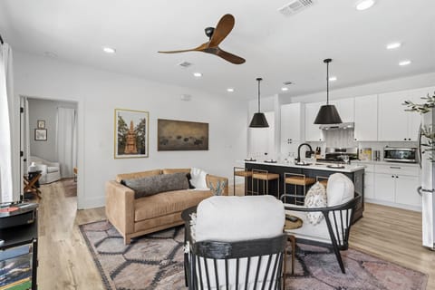 Living Room: Vibrant space with artful touches and a stylish kitchen for unforgettable gatherings!