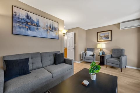 Comfortable living room w/ plush seating, soft lighting & an inviting space to unwind together