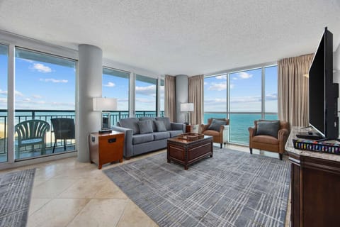 Large windows frame the coast providing a calm backdrop for a slow afternoon indoors.