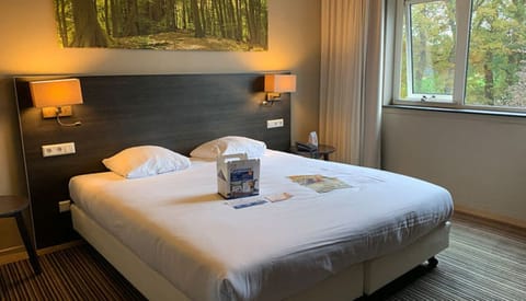 Sink into plush bedding and wake to leafy window views.