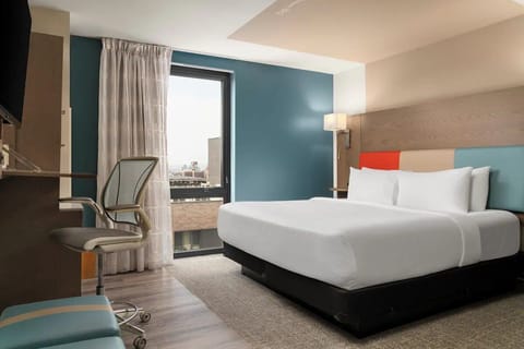 Unwind in a bright, modern room with city views.