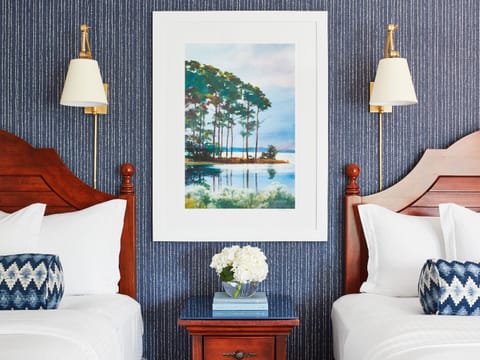 Drift off between crisp linens and calming coastal artwork.