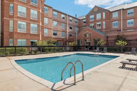 Dive into sunny afternoons by the sparkling courtyard pool.