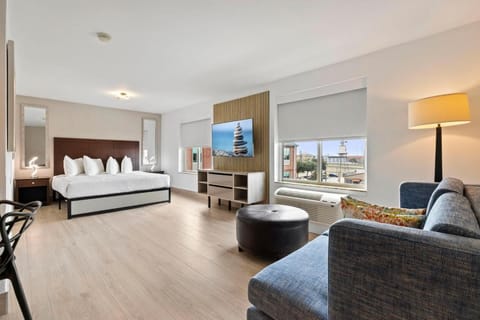 Step into a spacious studio retreat with airy city views.