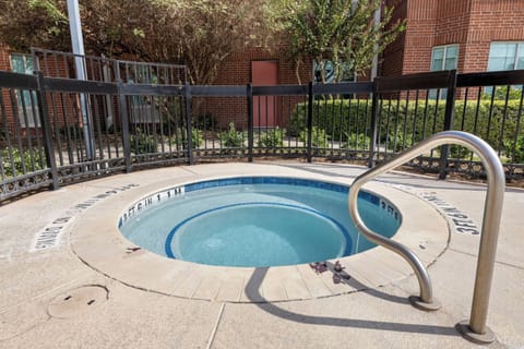 Unwind in the bubbling hot tub after a busy day.