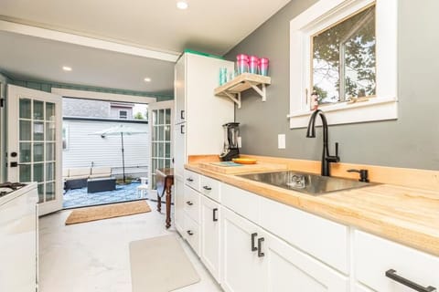 Fully stocked kitchen with a window AC unit to keep cool