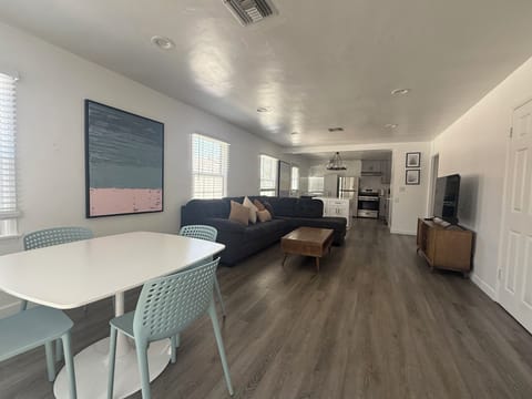 View from entrance of living room into open kitchen