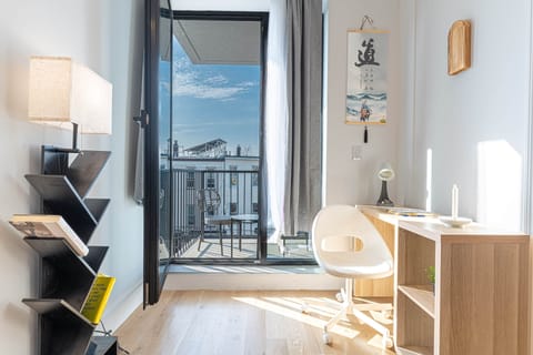 Workspace by balcony with natural light and outdoor access