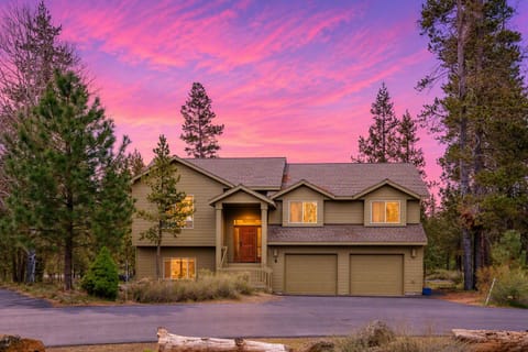Peaceful forest retreat with spacious driveway and stunning sunset views