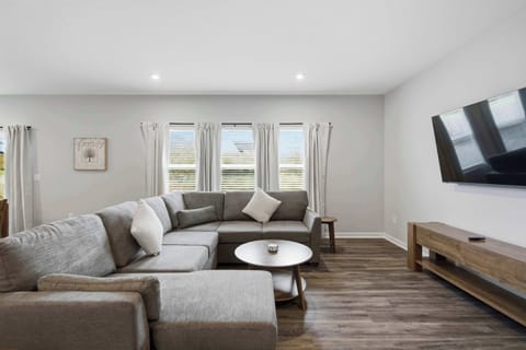 Curl up in the chic living room & stream your favorites on the smart TV​