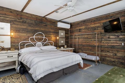 Retreat to the cozy ambiance of the master bedroom, furnished with a comfortable king-sized bed for a peaceful night's sleep.