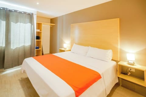 King bed, hair dryer, iron and security box in the bedroom