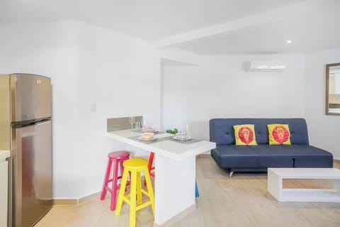 Living room, kitchen and dining. Sofa folds flat for an extra sleeping space 