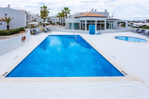 Dive into sunlit waters with loungers and wide deck space.