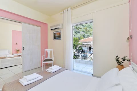 Bedroom with a double bed with access to balcony
