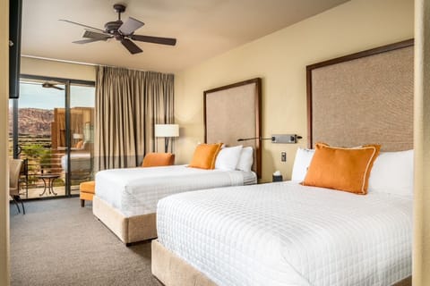 Wake up to red-rock views from your bright, airy bedroom.