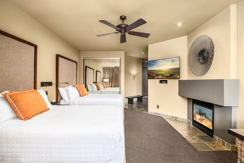 Drift off in crisp beds beside a warm, glowing fireplace.