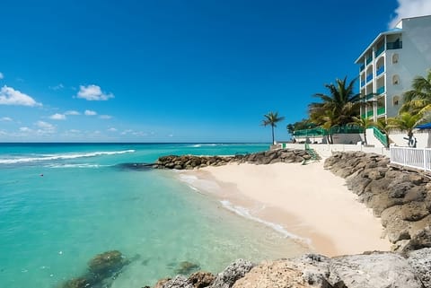 Wander barefoot to the quiet cove and soft sand.