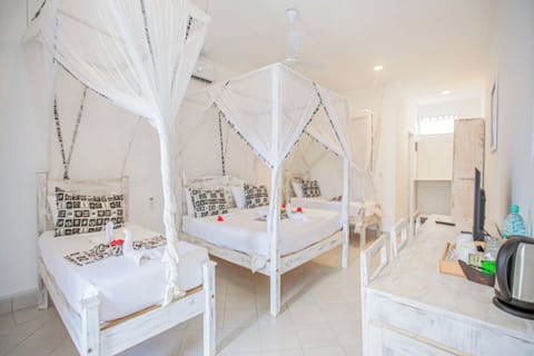 Settle into a bright, open space with simple beachy comforts.