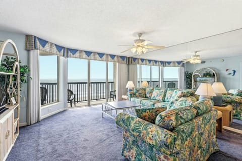 The ocean front living room is well-appointed with comfortable furnishings.