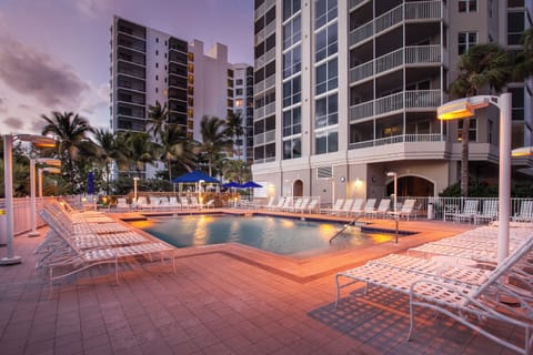 Unwind at dusk as the pool glows softly.