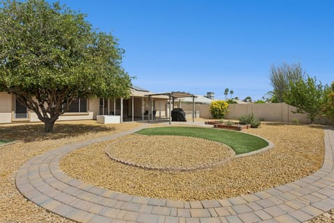 Take in the entire backyard, from the covered patio to the desert landscaping